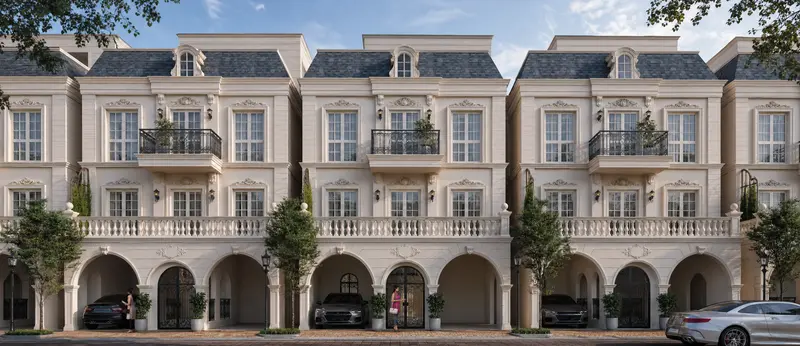 The cream rendered row houses at Godrej Florenne, with their arched car porches and slate mansard roofs
