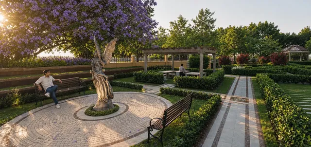 The barbecue area with seating under planting at Godrej Regent Park